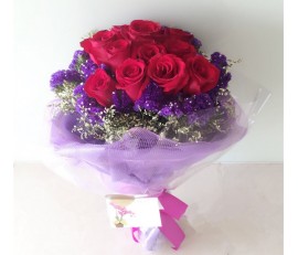 F79 RED ROSES BOUQUET WITH PURPLE WRAPPING IN ROUND